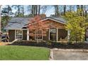 Charming home featuring manicured front lawn and meticulous landscaping at 6337 Lake View Dr, Buford, GA 30518