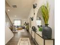 Bright entryway featuring hardwood floors, stylish decor, and an open view to the living room at 3058 Yellowhammer Dr, Marietta, GA 30064