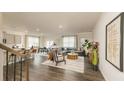 Open-concept living area showcasing modern furnishings, hardwood floors, and an abundance of natural light at 3058 Yellowhammer Dr, Marietta, GA 30064