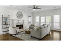 Bright living room with fireplace, French doors, and hardwood flooring offers a cozy retreat at 78 Crumley Se St, Atlanta, GA 30312
