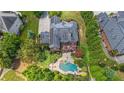 A stunning home with a backyard oasis, featuring a pool and a spa at 1391 Harris Rd, Lawrenceville, GA 30043