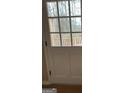 Glass paneled door leading to a wooden deck surrounded by a lush landscape at 213 Sharon Drive, Canton, GA 30115