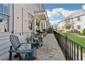 Inviting stone patio with comfortable seating and manicured lawn at 204 N Esplanade, Alpharetta, GA 30009