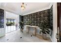 Grand entryway featuring designer wallpaper, light tile flooring, and a view of the outdoor living space at 3286 Northside Nw Pkwy # 1007, Atlanta, GA 30327