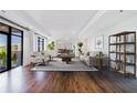 A bright living room with hardwood floors and large windows that provide plenty of natural light at 3286 Northside Nw Pkwy # 1007, Atlanta, GA 30327