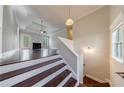 View of the living room from the top of the entry stairs, showcasing an open concept space at 6490 Lake Esther Dr, Fairburn, GA 30213