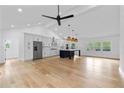 A spacious kitchen featuring stainless steel appliances, lots of light, and a contrasting blue island at 1194 Clearview Ne Dr, Brookhaven, GA 30319