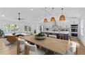Bright open living space featuring modern furnishings, a spacious dining table, and a stylish kitchen island at 1194 Clearview Ne Dr, Brookhaven, GA 30319