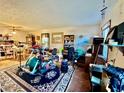 Spacious living room with ceiling fan, furniture, and natural light at 6917 Laurelwood Dr, Douglasville, GA 30135