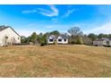 Residential neighborhood home situated on a spacious lot with mature trees at 81 Bridgemill Dr, Douglasville, GA 30134