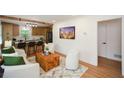 Inviting living room with hardwood floors and open concept access to kitchen at 1048 Pinehurst Se Dr, Smyrna, GA 30080