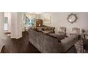 Comfortable living room with hardwood floors, large windows and elegant furniture at 1310 Roger Trace, Lithonia, GA 30058