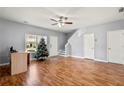 Inviting living room with hardwood floors and staircase, brightened by natural light at 1780 Brookside Lay Cir, Norcross, GA 30093