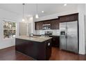 Modern kitchen with stainless steel appliances, dark cabinets and granite countertops at 3706 Clovis Nw Ct, Atlanta, GA 30331