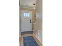 Light and airy entryway with a new door and updated lighting, showcasing modern design elements at 403 Oak Harbor Ct, Marietta, GA 30066