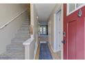 Bright foyer featuring a staircase, new flooring, and natural light streaming through the door at 403 Oak Harbor Ct, Marietta, GA 30066