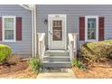 Inviting front entrance with well-manicured landscaping, featuring a storm door and classic exterior design at 403 Oak Harbor Ct, Marietta, GA 30066