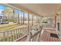 Inviting porch with rocking chairs, offering a relaxing outdoor space at 4565 Canebrake Ct, Powder Springs, GA 30127