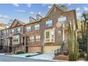 Beautiful brick townhomes with well-maintained landscaping, front garages, and inviting staircases at 2766 Birch Grove Se Ln # 11, Marietta, GA 30067