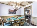 Beautiful dining room with decorative chandelier and wainscoting, perfect for Gathering gatherings and entertaining at 2195 Well Springs Dr, Buford, GA 30519