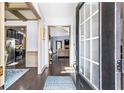 Inviting foyer with hardwood floors leads to an open-concept living space and kitchen with stainless steel appliances at 2195 Well Springs Dr, Buford, GA 30519