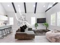 Bright, open-concept living space featuring modern finishes, exposed beams, and ample natural light at 514 English Nw Ave, Atlanta, GA 30318