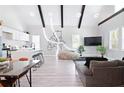 Spacious living area with modern accents, open to the kitchen with stainless steel appliances at 514 English Nw Ave, Atlanta, GA 30318