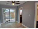 Bright dining area with sliding glass doors leading to the backyard and a view of the garden at 136 Peachtree Memorial Nw Dr # Ga8, Atlanta, GA 30309
