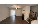 A bright living room with hardwood floors and a fireplace at 36 S Auburn Landing Pl, Auburn, GA 30011