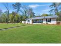 Well-maintained home with a spacious, manicured lawn perfect for outdoor activities at 2151 Blaylock Dr, Marietta, GA 30062