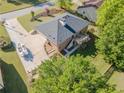 Aerial view of brick home with spacious driveway, boat, and large back deck at 458 Valley Woods Se Cir, Conyers, GA 30094