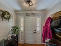 Bright entryway featuring hardwood floors and classic decor, creating a warm and inviting space at 458 Valley Woods Se Cir, Conyers, GA 30094