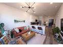 Cozy living room and kitchen with modern lighting, decor, and stainless appliances at 525 Parkway Ne Dr # 103, Atlanta, GA 30308