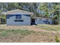 Charming single-story home with a blue brick exterior and a well-maintained front yard at 4756 Fellsridge Dr, Stone Mountain, GA 30083
