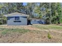 Charming single-story home with a blue brick exterior and a well-maintained front yard at 4756 Fellsridge Dr, Stone Mountain, GA 30083