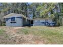 Charming single-story home with a blue brick exterior and a well-maintained front yard at 4756 Fellsridge Dr, Stone Mountain, GA 30083