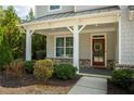 Charming front porch with inviting entrance, well-maintained landscaping, and lovely architectural details at 1977 Boyd Trace Nw Ln, Atlanta, GA 30318