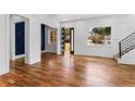 Bright living room with hardwood floors, modern staircase, and large windows allowing for ample natural light at 387 S Howard Se St, Atlanta, GA 30317