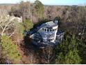 Secluded property surrounded by lush trees, offering a private and tranquil setting at 3810 Galloway Dr, Roswell, GA 30075