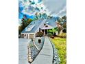 Striking home showcasing unique architectural design, three-car garage, and professionally landscaped yard at 3810 Galloway Dr, Roswell, GA 30075