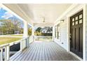 Spacious covered front porch with ceiling fan and views of the neighborhood at 955 Bouldercrest Se Dr, Atlanta, GA 30316