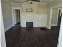 Living room with dark-toned flooring and fireplace, showcasing a cozy and inviting atmosphere at 1012 Burns Dr, Atlanta, GA 30310