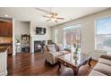 Comfortable living area with hardwood floors, fireplace, and access to an outdoor patio at 4329 Tacoma Trce, Suwanee, GA 30024