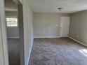 Inviting living area featuring tile flooring, neutral walls, and a view into another room at 251 Banberry Se Dr, Atlanta, GA 30315