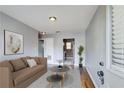 Cozy living room with hardwood floors, neutral paint and furniture, and views to kitchen area at 561 Formwalt Sw St # 6, Atlanta, GA 30312