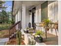 Inviting front porch with stylish seating, decor, and charming details at 994 Redbud Sw Ln, Atlanta, GA 30311