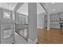 Inviting entryway with hardwood floors leading to a modern kitchen with stainless steel appliances at 2094 Callaway Nw Ct, Atlanta, GA 30318