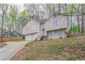 Charming two-story home with a two-car garage and a stairway to the entrance at 3841 Greenbrook Dr, Douglasville, GA 30135