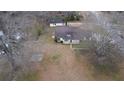An aerial view of a single-story home with a front porch and a traditional, well-maintained lawn at 2326 Noahs Ark Rd, Jonesboro, GA 30236