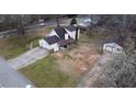 An aerial view of a single-story home with a long driveway and a traditional, well-maintained lawn at 2326 Noahs Ark Rd, Jonesboro, GA 30236